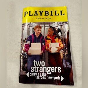 Two Strangers Carry A Cake Across New York Broadway Playbill December 2025